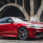 red ferrari 458 italia parked near building